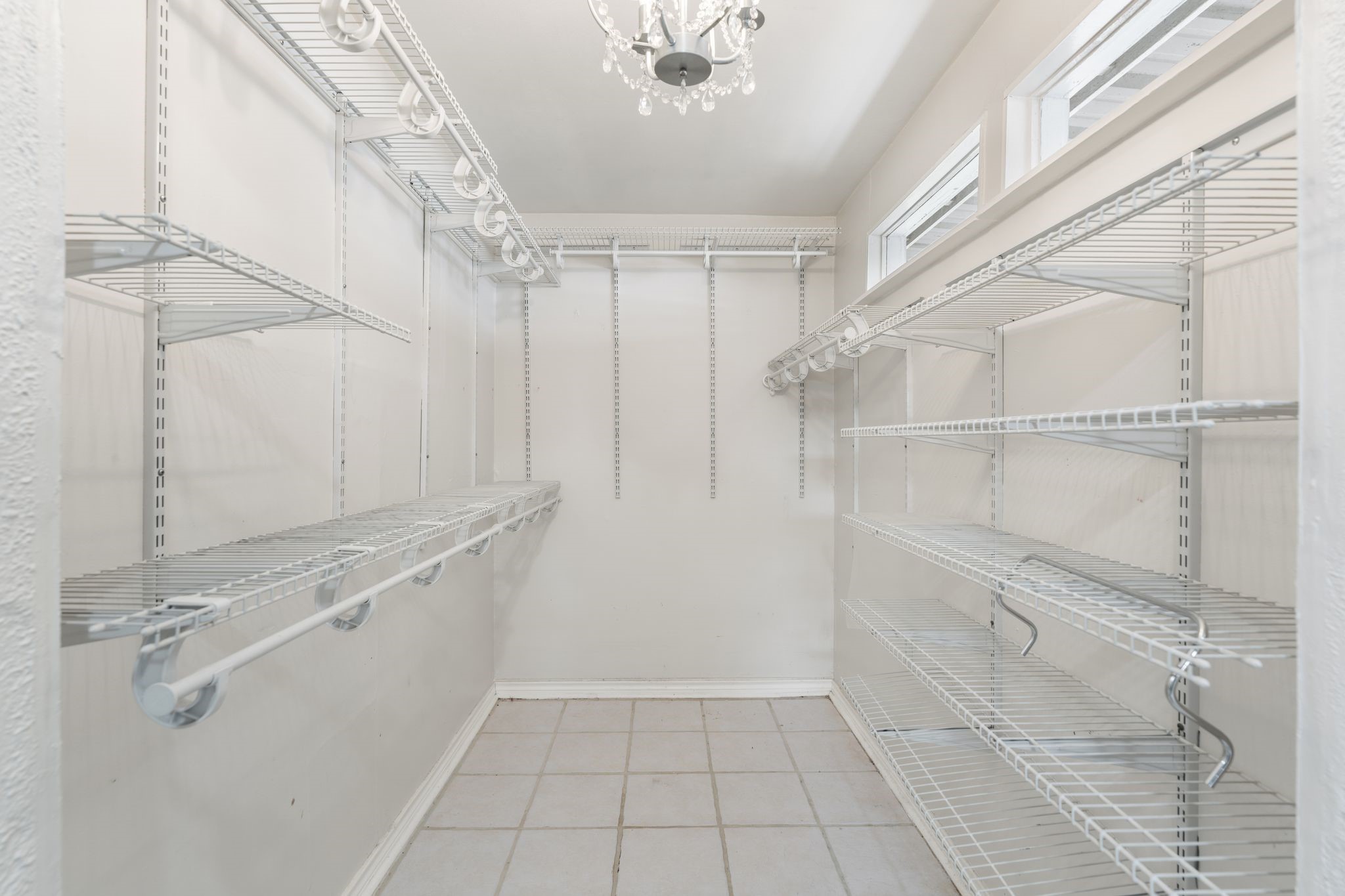 1811 West 14th 1/2 Street Houston, TX 77008 - Photo 13 of 25 a view of a kitchen with white cabinets and wooden floor