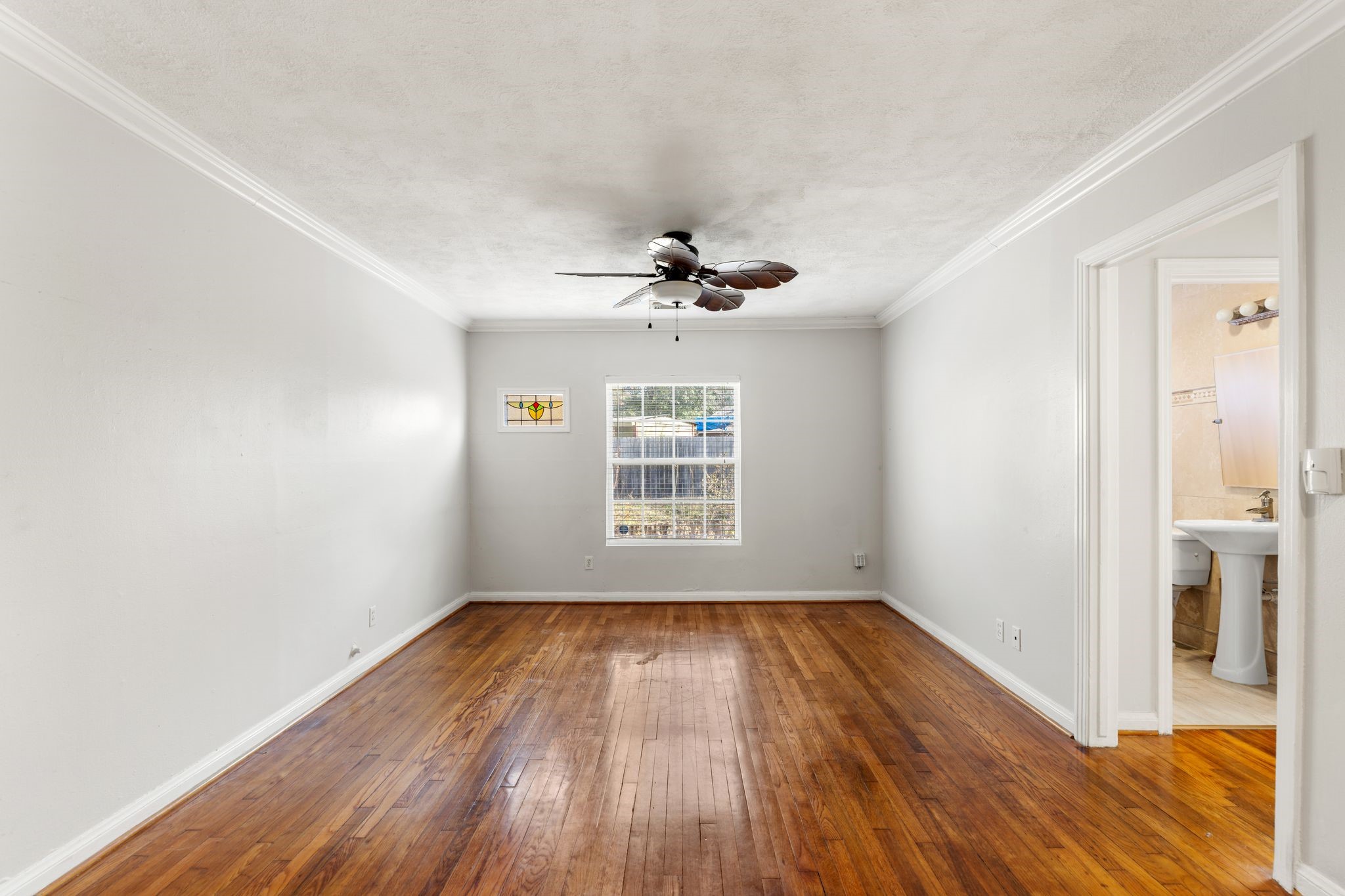 1811 West 14th 1/2 Street Houston, TX 77008 - Photo 18 of 25 a view of empty room with wooden floor and fan