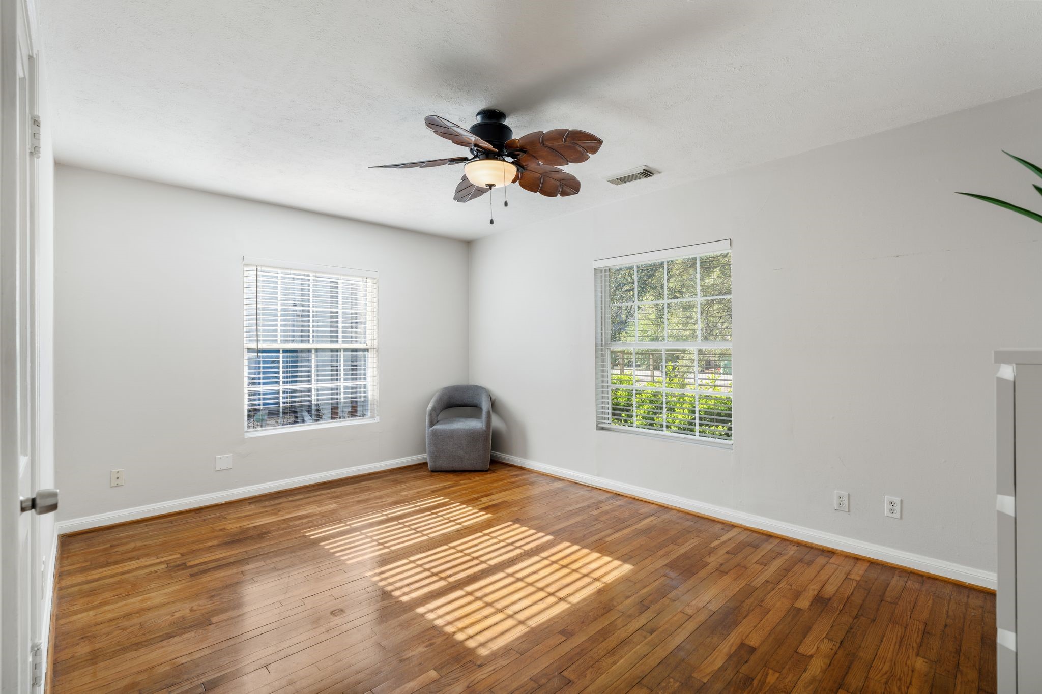 1811 West 14th 1/2 Street Houston, TX 77008 - Photo 6 of 25 a view of empty room with wooden floor and fan