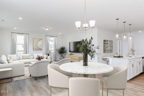 a dining room with wooden floor a chandelier a wooden table and chairs