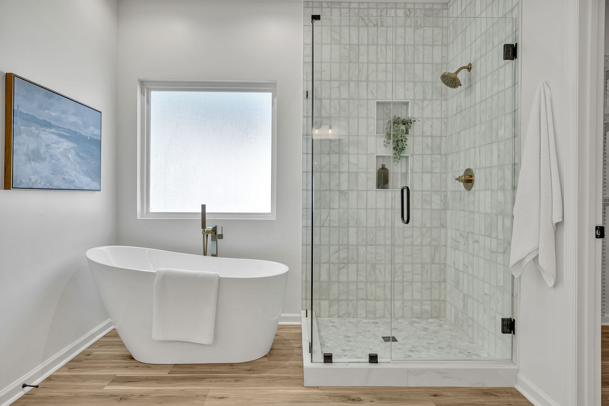 1601 Inverness Drive Spring Hill, TN 37174 - Photo 31 of 58 The primary bath of your dreams! Elegant and Modern master bath features free-standing soaking tub next to large and private window, large shower with Italian carrara marble tile on walls and shower floor with gold accents!