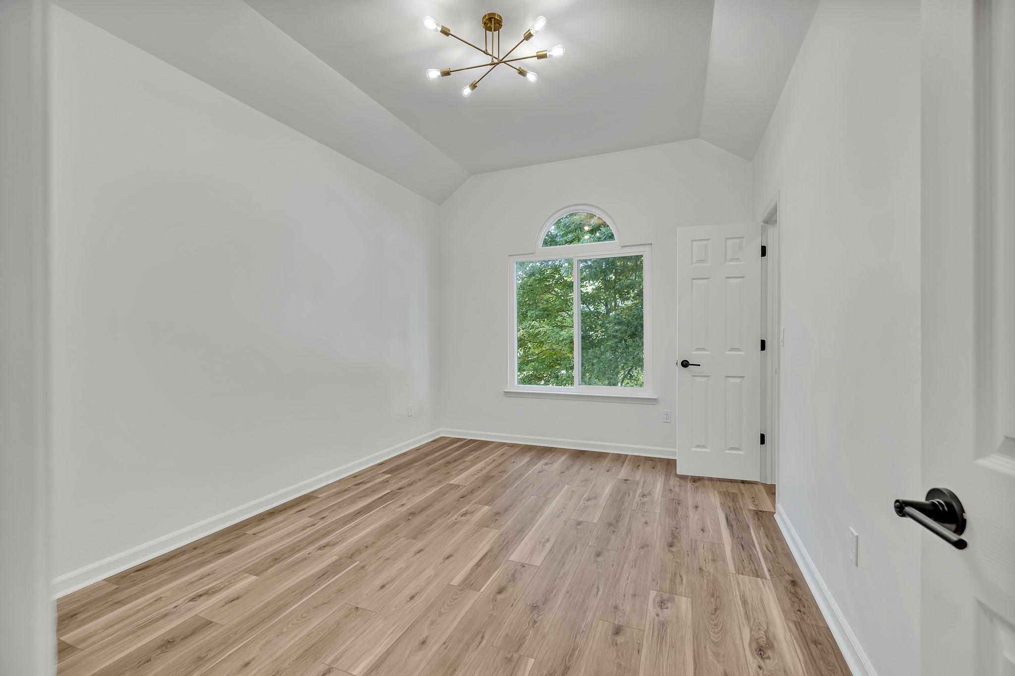 1601 Inverness Drive Spring Hill, TN 37174 - Photo 33 of 58 Your first of 3 secondary bedrooms. This is the largest of the three - measuring 11 x 14. Large window at the front of the room overlooks your mature canopy trees in the front yard of the home.