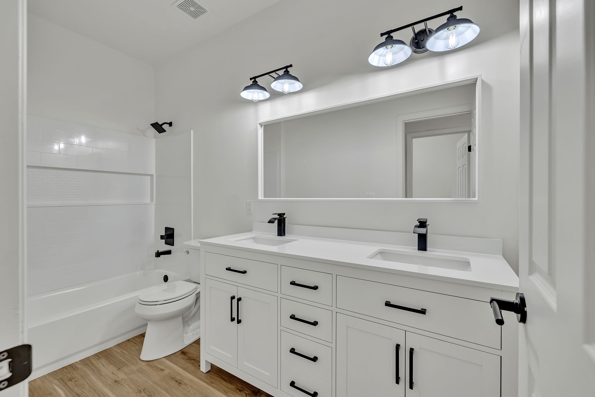 1601 Inverness Drive Spring Hill, TN 37174 - Photo 35 of 58 Second full bathroom in this home features a beautifully renovated double-vanity, modern lights and fixtures and convenient tub/shower combo.