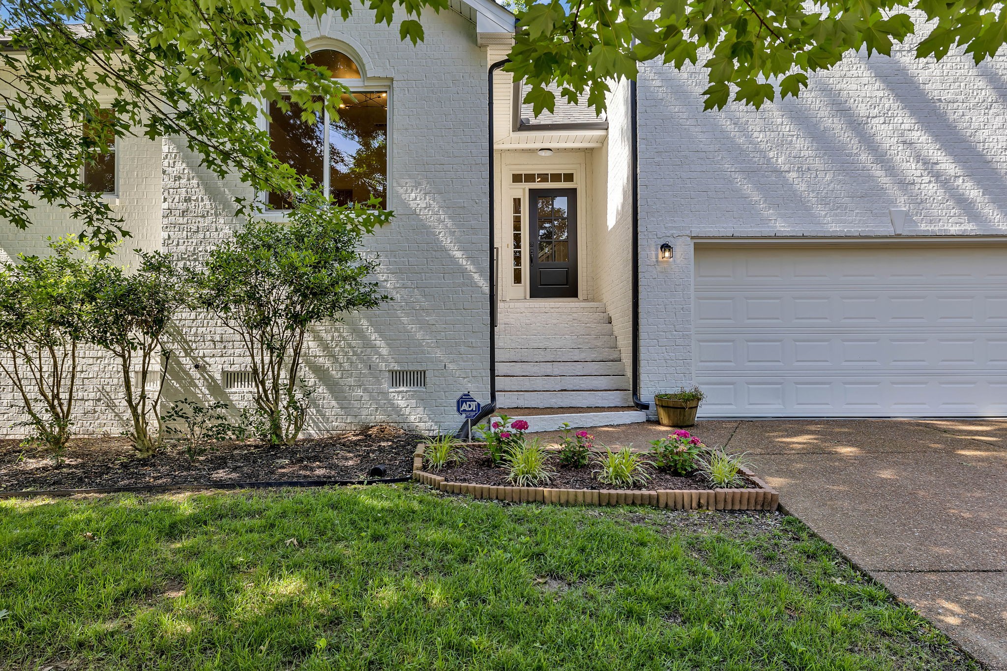 1601 Inverness Drive Spring Hill, TN 37174 - Photo 6 of 58 Beautiful landscaping and brand new door greet you. This home has a ton of natural light brought in by all of the oversized windows.