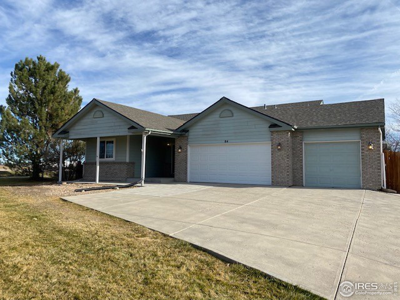 84 Pike Lane Severance, CO 80550 - Photo 1 of 1 a front view of a house with a yard and garage