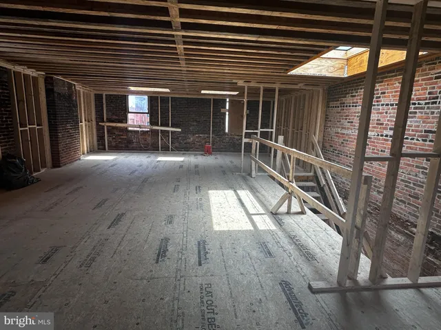 a view of empty room with stairs