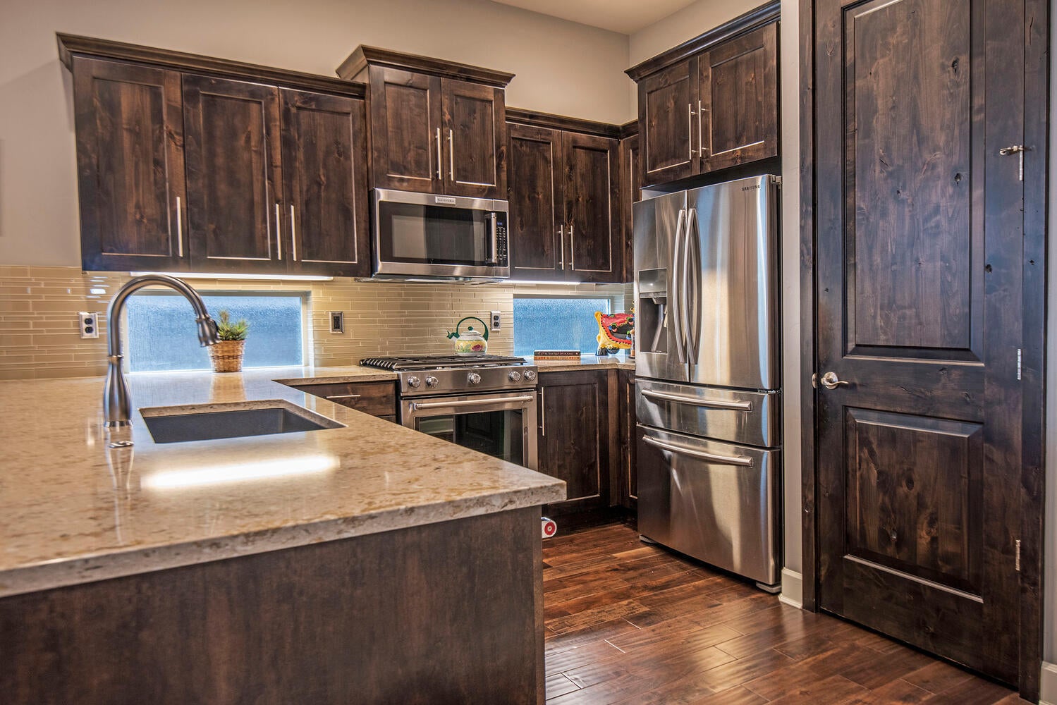 2630 Northwest Boulder Ridge Loop Bend, OR 97703 - Photo 8 of 31 Included stainless steel appliances. Quartz countertops and durable composite sink.