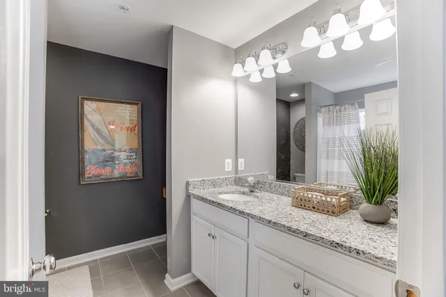 a white toilet sitting next to a shower curtain