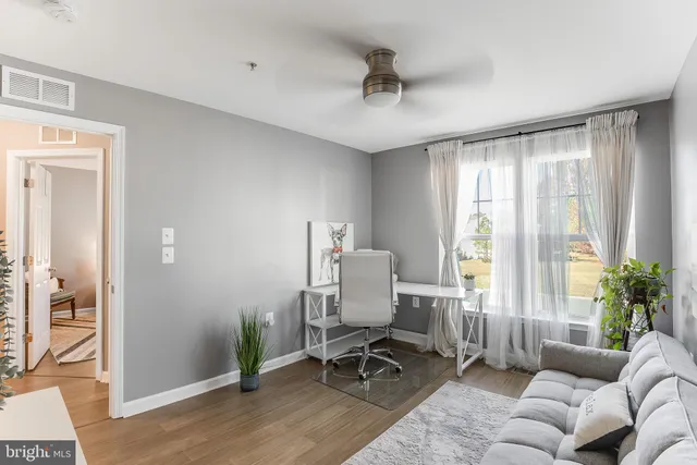 a view of a livingroom with furniture and wooden floor