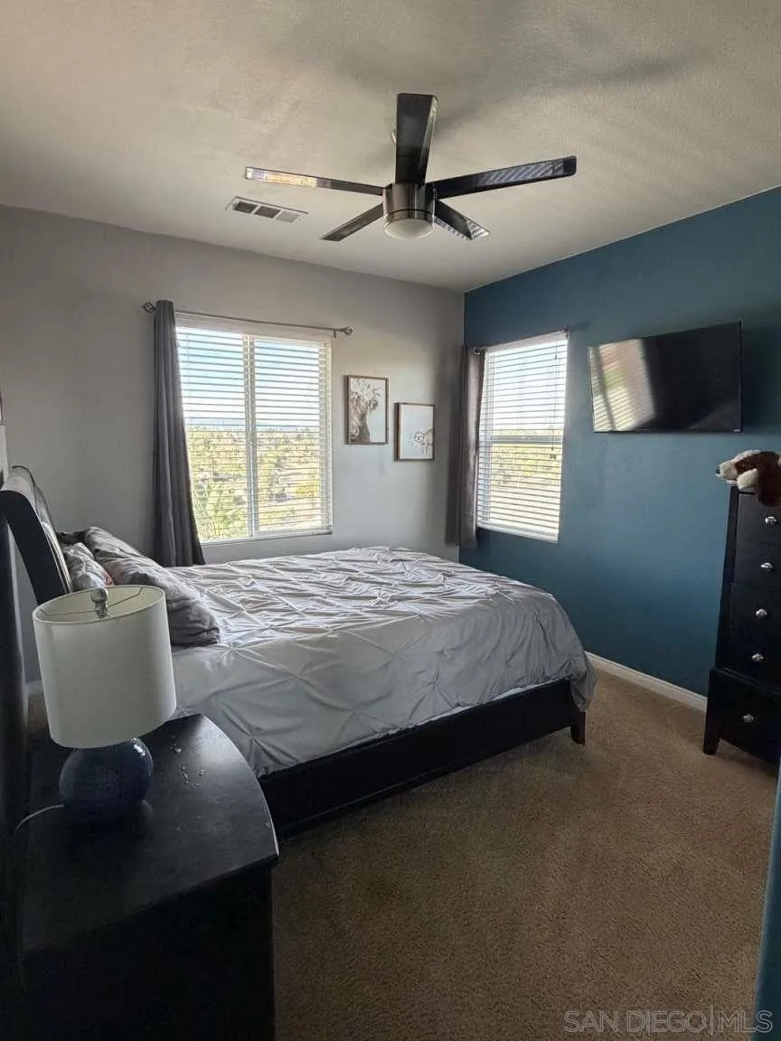 2327 Clearcrest Lane Fallbrook, CA 92028 - Photo 15 of 28 a bedroom with a bed chair and window