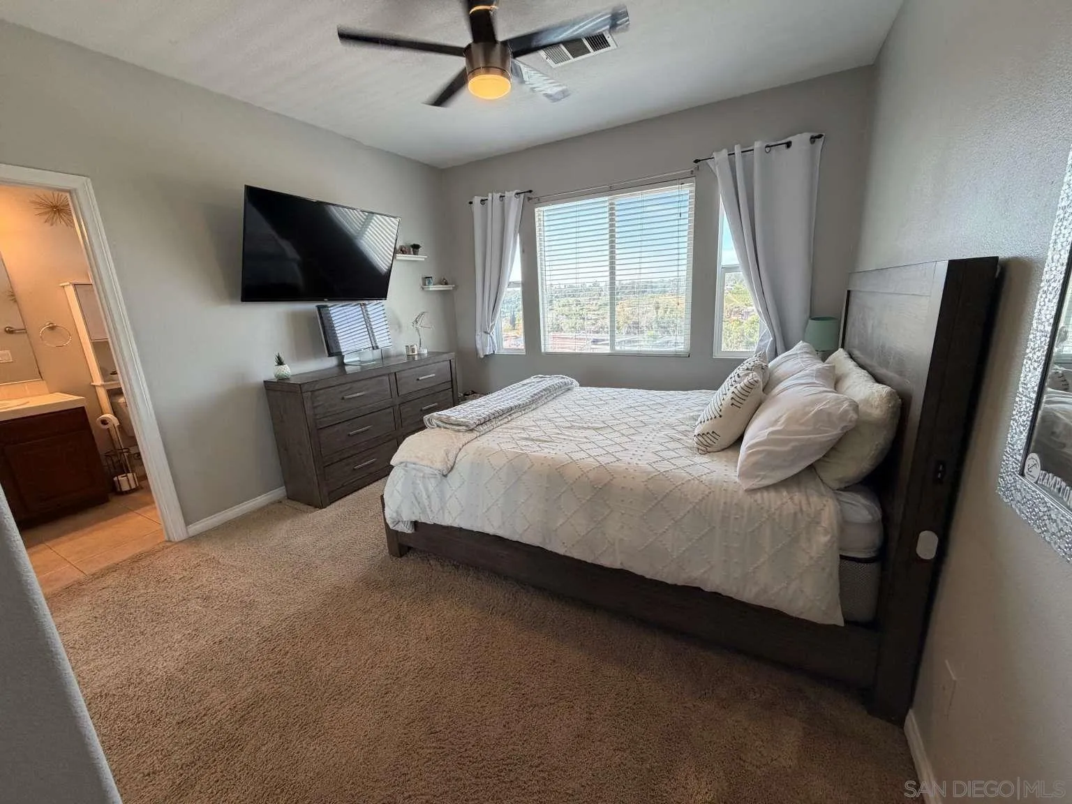 2327 Clearcrest Lane Fallbrook, CA 92028 - Photo 17 of 28 a bedroom with a bed tv and window