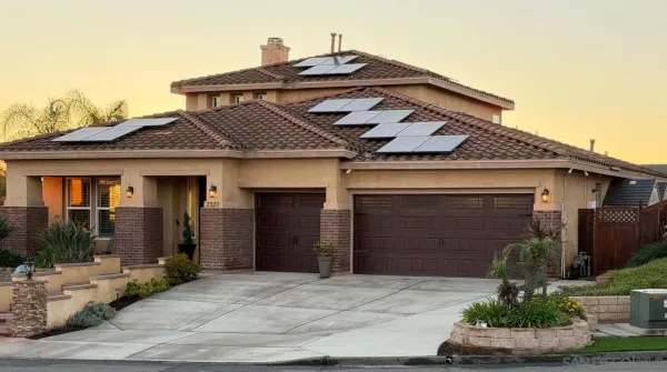 a view of a patio with table and chairs with wooden floor and fence