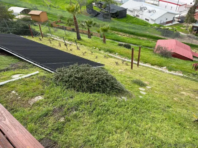 a view of a backyard with a swing