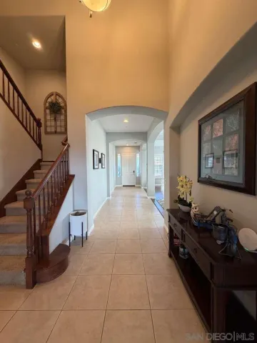 a living room with couches and furniture with wooden floor