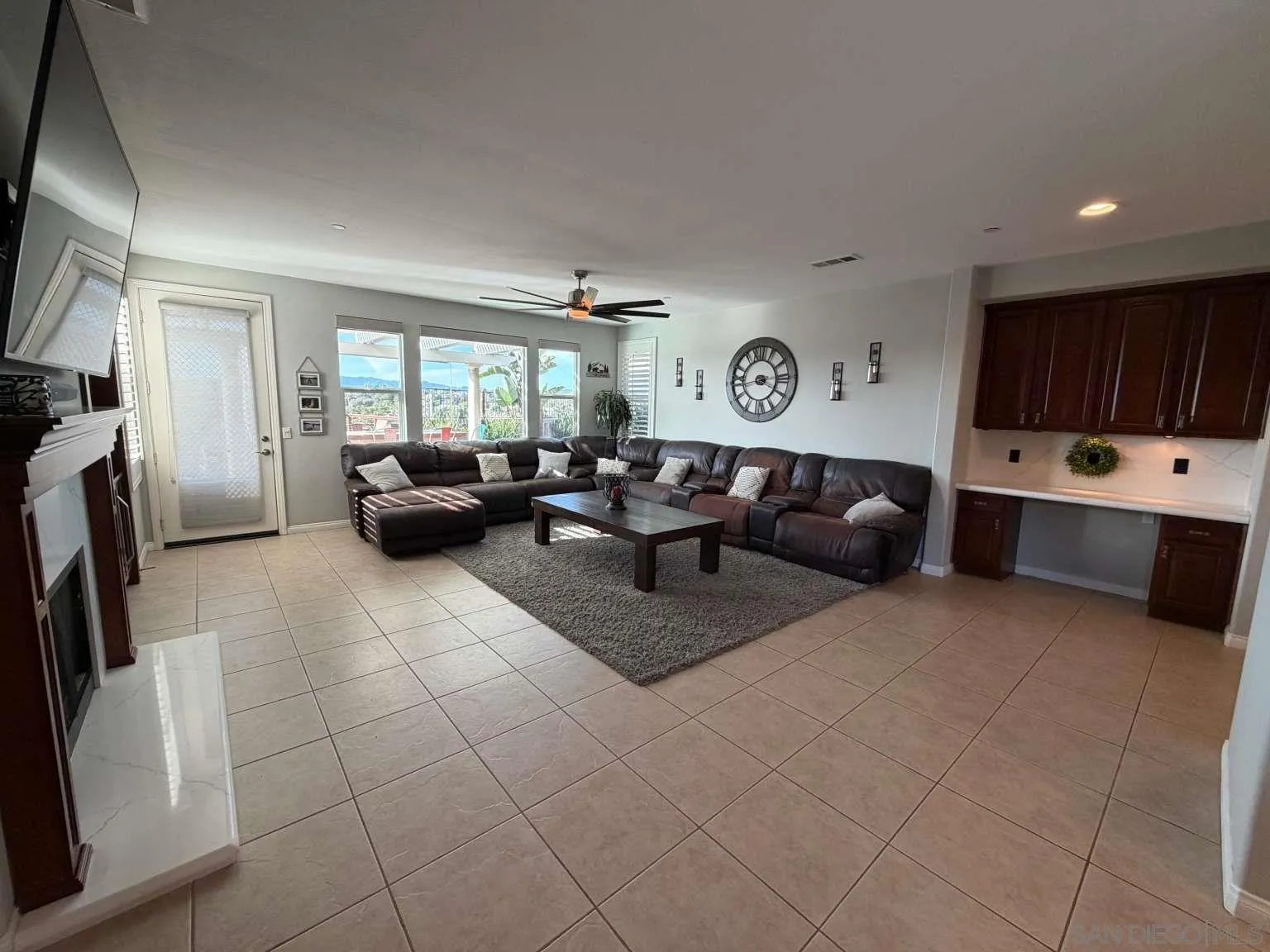 2327 Clearcrest Lane Fallbrook, CA 92028 - Photo 6 of 28 a living room with a couch and a flat screen tv