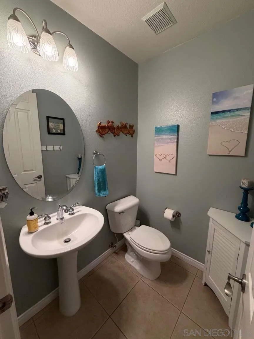 2327 Clearcrest Lane Fallbrook, CA 92028 - Photo 8 of 28 a bathroom with a toilet sink and mirror