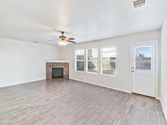 a view of an empty room with a window