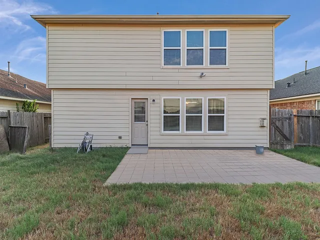 a house view with a backyard space