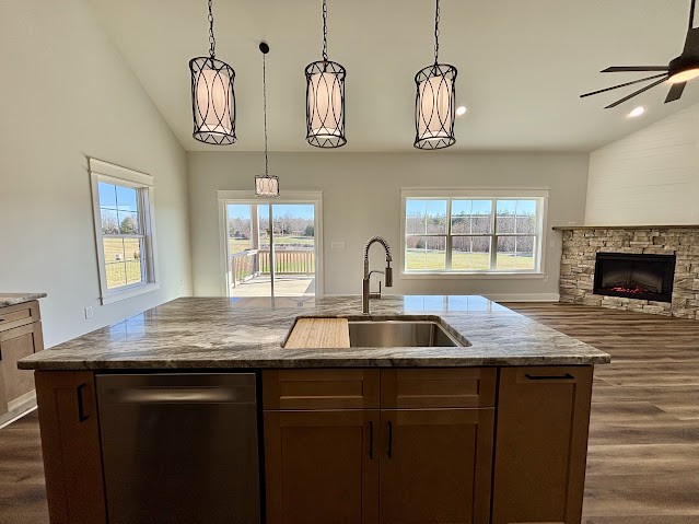 8184 Aedc Road Estill Springs, TN 37330 - Photo 14 of 43 a kitchen with granite countertop a sink and a stove