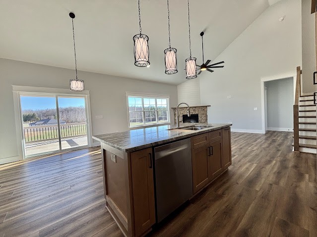 8184 Aedc Road Estill Springs, TN 37330 - Photo 15 of 43 a kitchen with stainless steel appliances granite countertop wooden floors and a view of living room