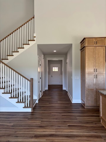 8184 Aedc Road Estill Springs, TN 37330 - Photo 25 of 43 a view of a hallway with wooden floor and stairs