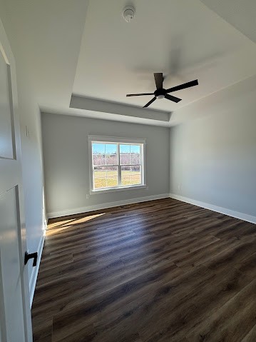 8184 Aedc Road Estill Springs, TN 37330 - Photo 29 of 43 a view of an empty room with wooden floor and a window