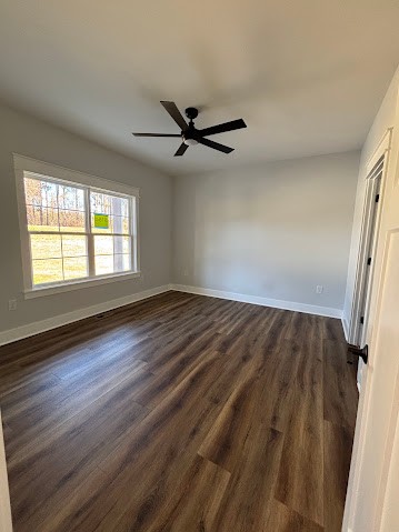 8184 Aedc Road Estill Springs, TN 37330 - Photo 35 of 43 an empty room with wooden floor fan and windows