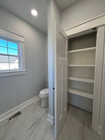8184 Aedc Road Estill Springs, TN 37330 - Photo 39 of 43 a bathroom with a toilet and a window