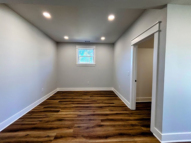 8184 Aedc Road Estill Springs, TN 37330 - Photo 42 of 43 a view of an empty room with wooden floor
