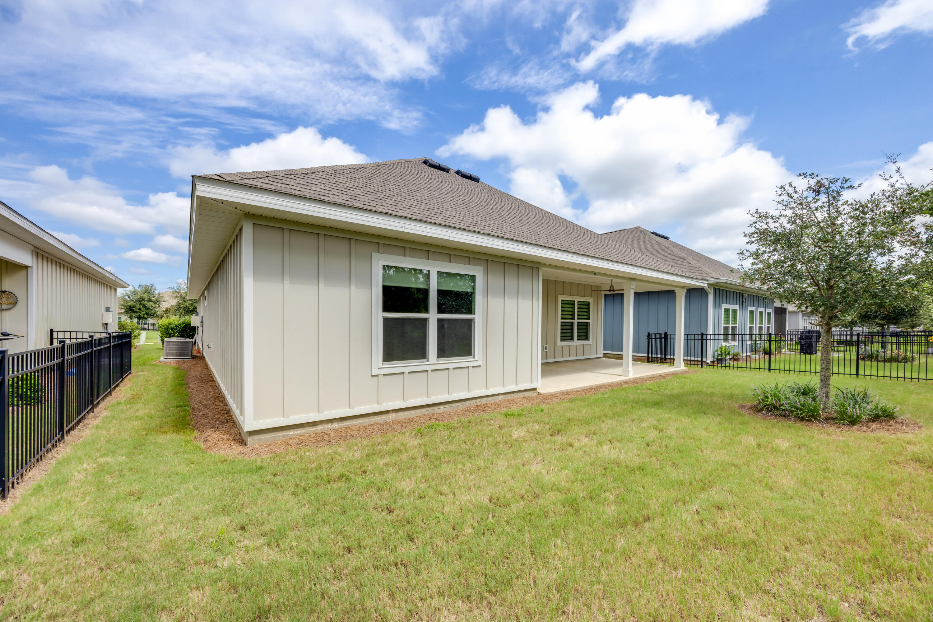 121 Lightning Bug Lane Freeport, FL 32439 - Photo 38 of 53 a view of a house with backyard and garden