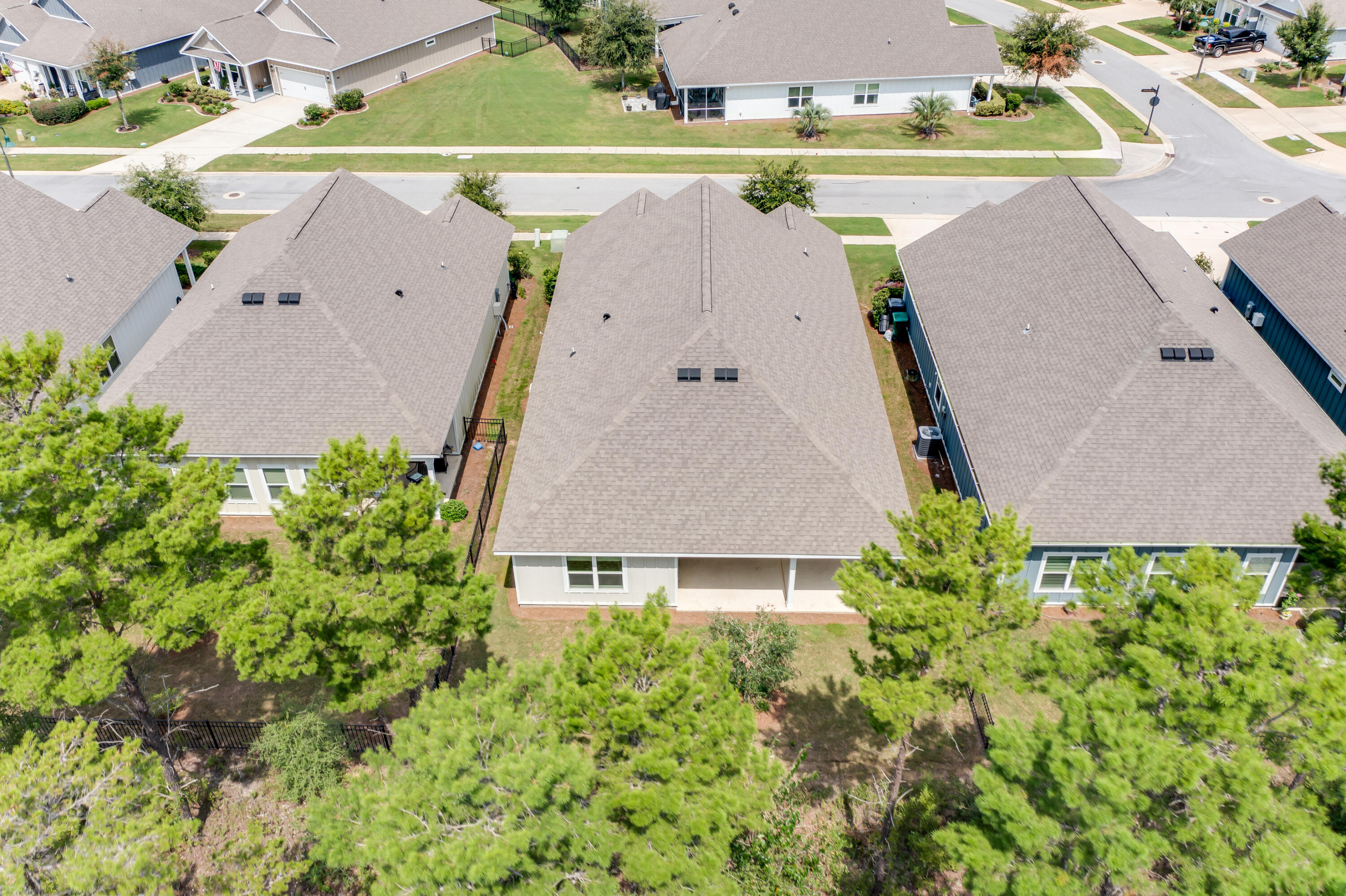 121 Lightning Bug Lane Freeport, FL 32439 - Photo 43 of 53 an aerial view of a house with a yard and a large tree