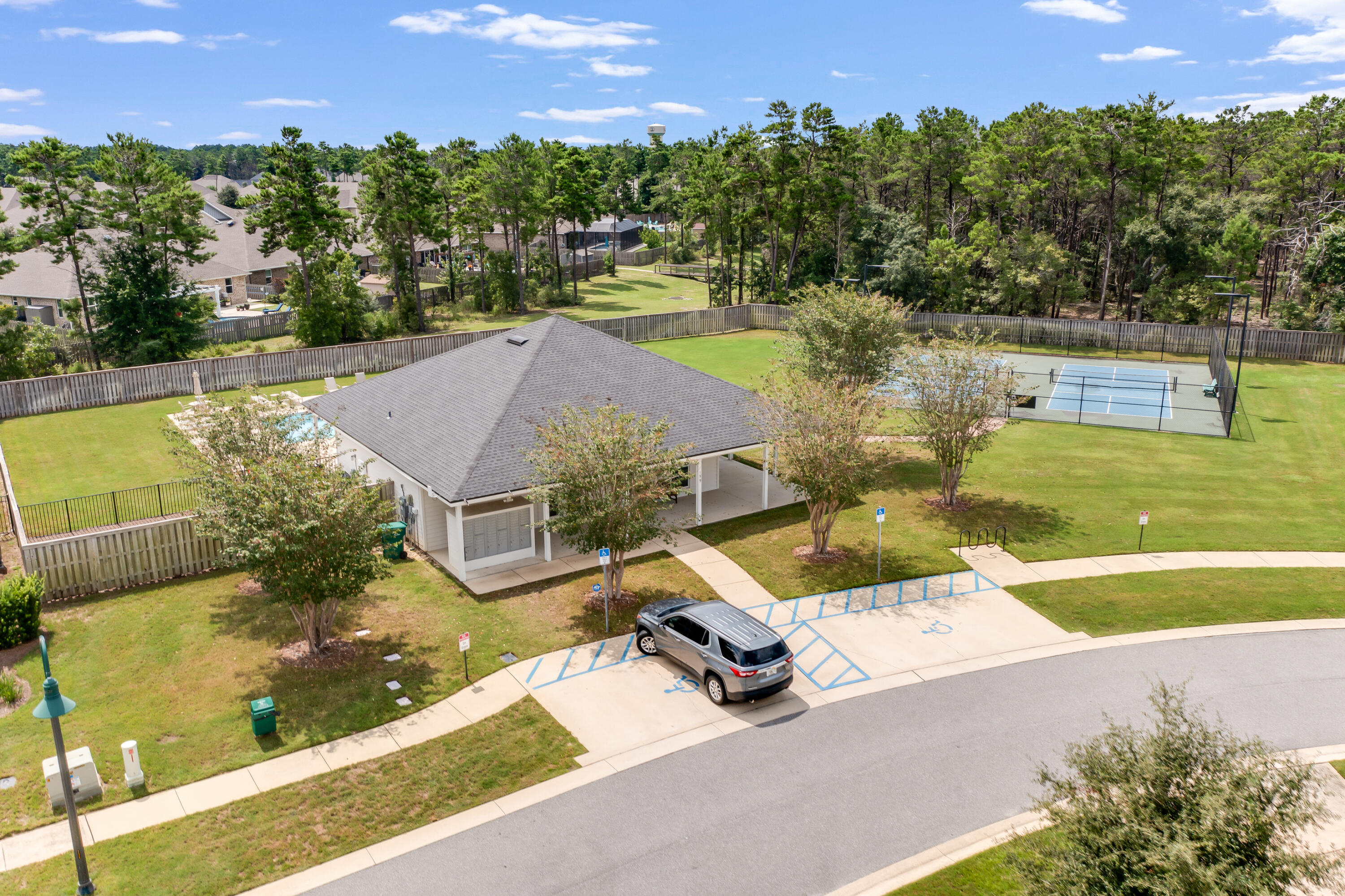 121 Lightning Bug Lane Freeport, FL 32439 - Photo 45 of 53 a view of a swimming pool with a patio and a yard