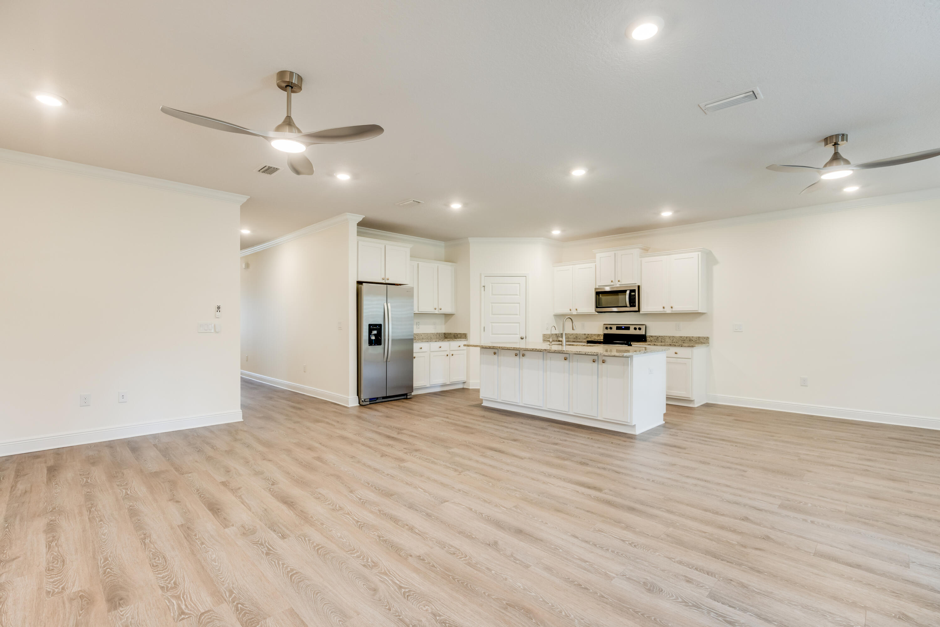 121 Lightning Bug Lane Freeport, FL 32439 - Photo 7 of 53 a view of kitchen with refrigerator sink and cabinets