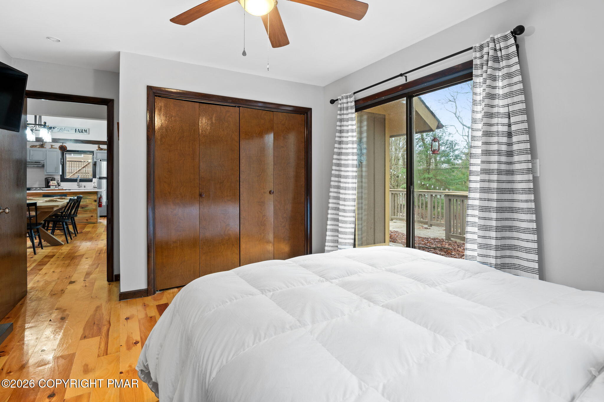 81 Split Rock Road Lake Harmony, PA 18624 - Photo 19 of 36 a bedroom with a large bed and a chandelier