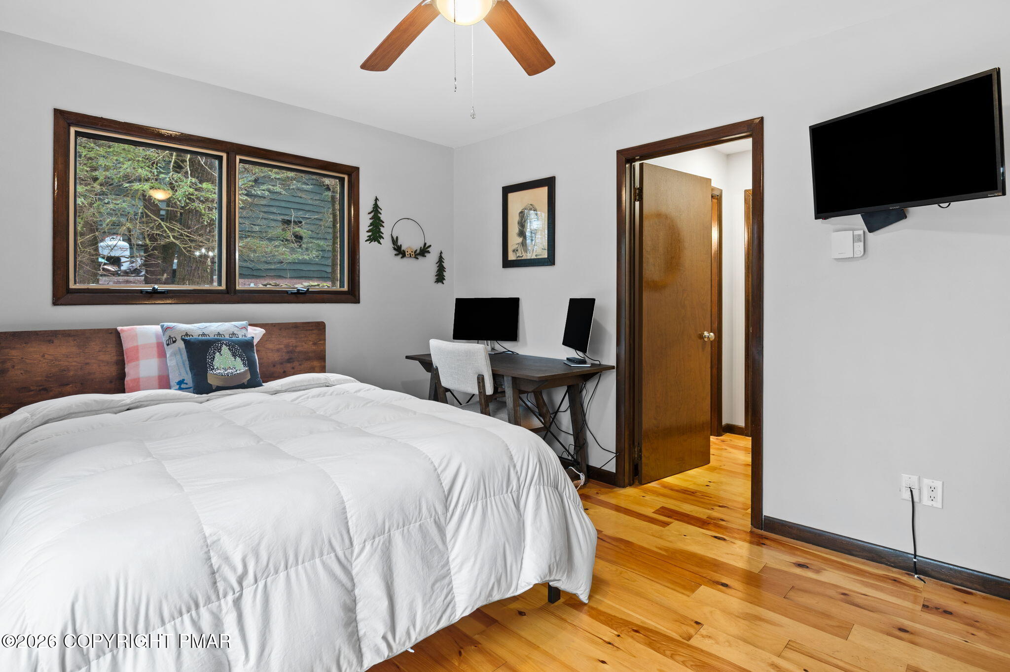 81 Split Rock Road Lake Harmony, PA 18624 - Photo 20 of 36 a bedroom with a bed and a flat screen tv