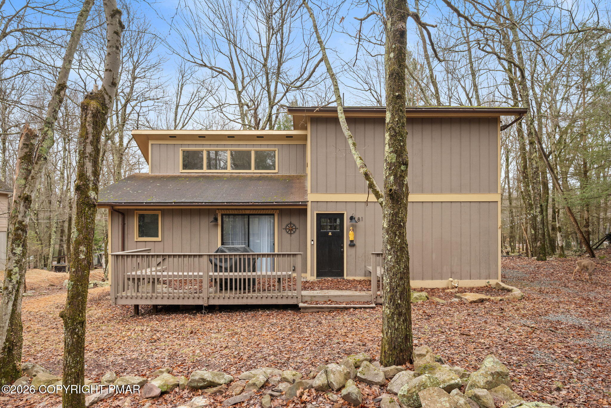 81 Split Rock Road Lake Harmony, PA 18624 - Photo 2 of 36 a front view of a house with garden