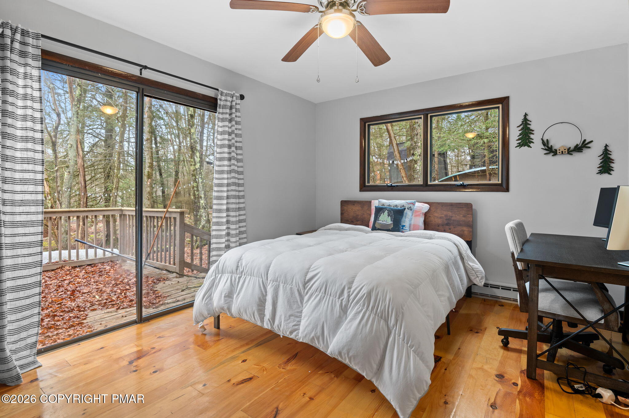 81 Split Rock Road Lake Harmony, PA 18624 - Photo 21 of 36 a bedroom with a bed and a large window