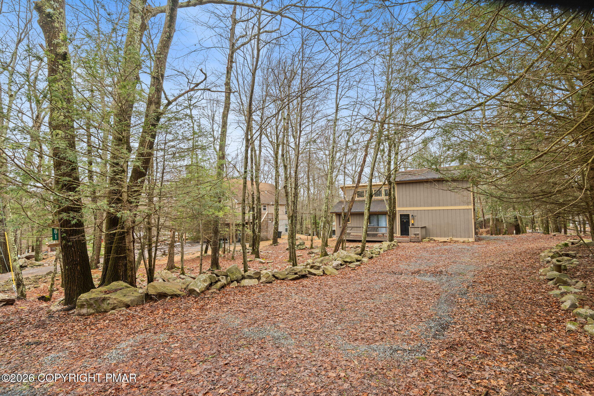 81 Split Rock Road Lake Harmony, PA 18624 - Photo 27 of 36 a view of a house with a yard covered in snow