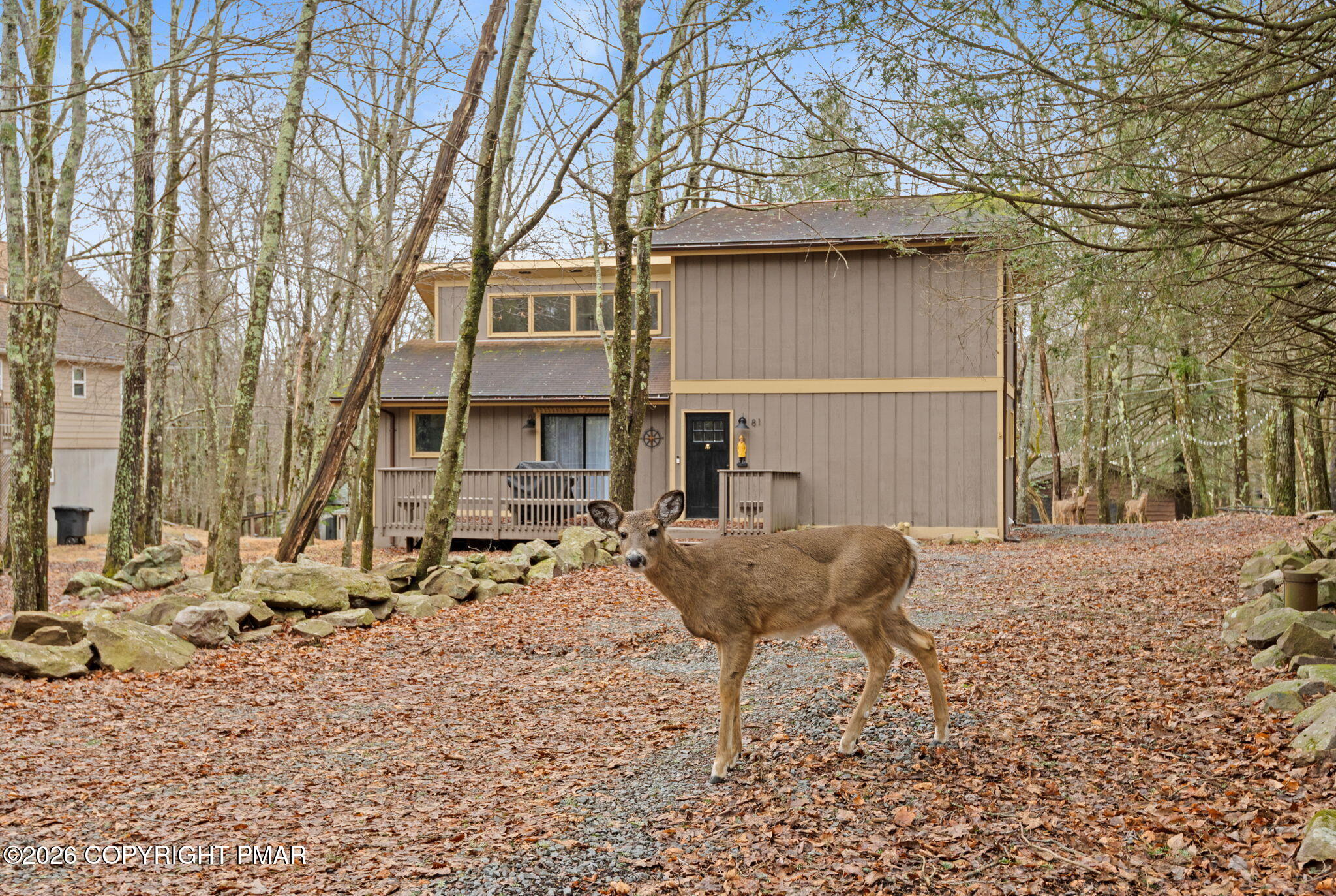 81 Split Rock Road Lake Harmony, PA 18624 - Photo 31 of 36 a backyard of a house with table and chairs