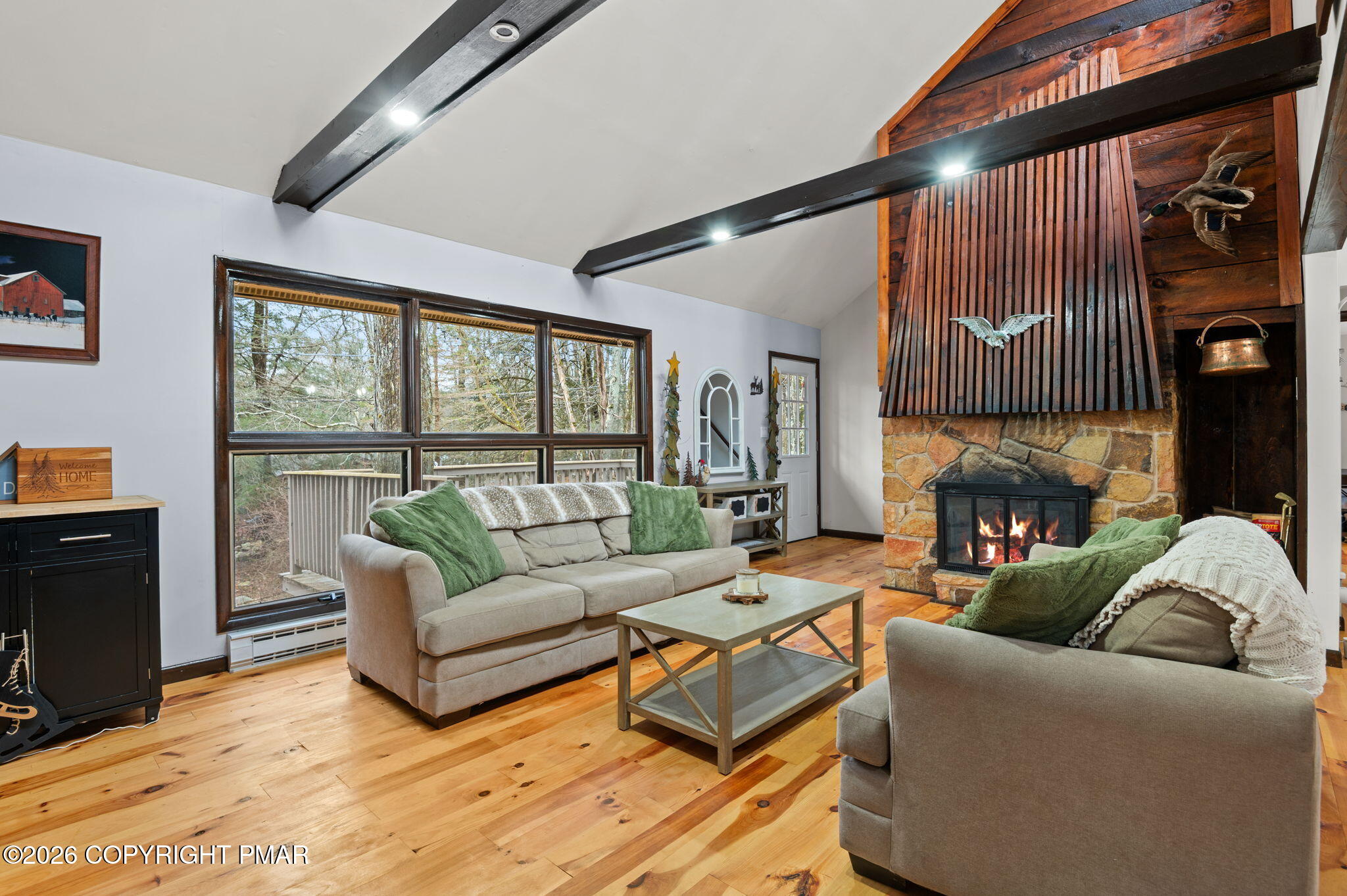 81 Split Rock Road Lake Harmony, PA 18624 - Photo 4 of 36 a living room with furniture and a fireplace
