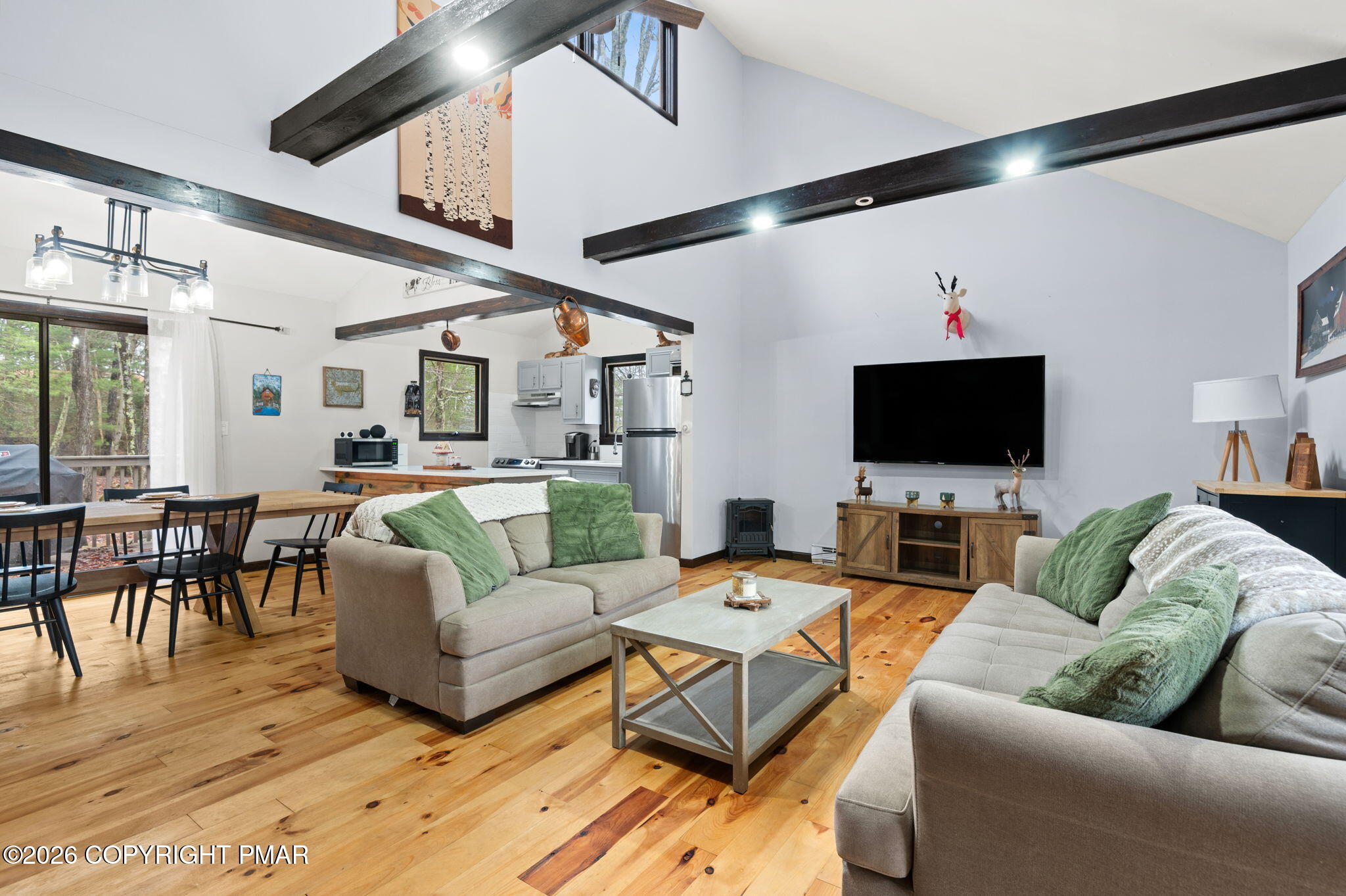 81 Split Rock Road Lake Harmony, PA 18624 - Photo 5 of 36 a living room with furniture and a flat screen tv