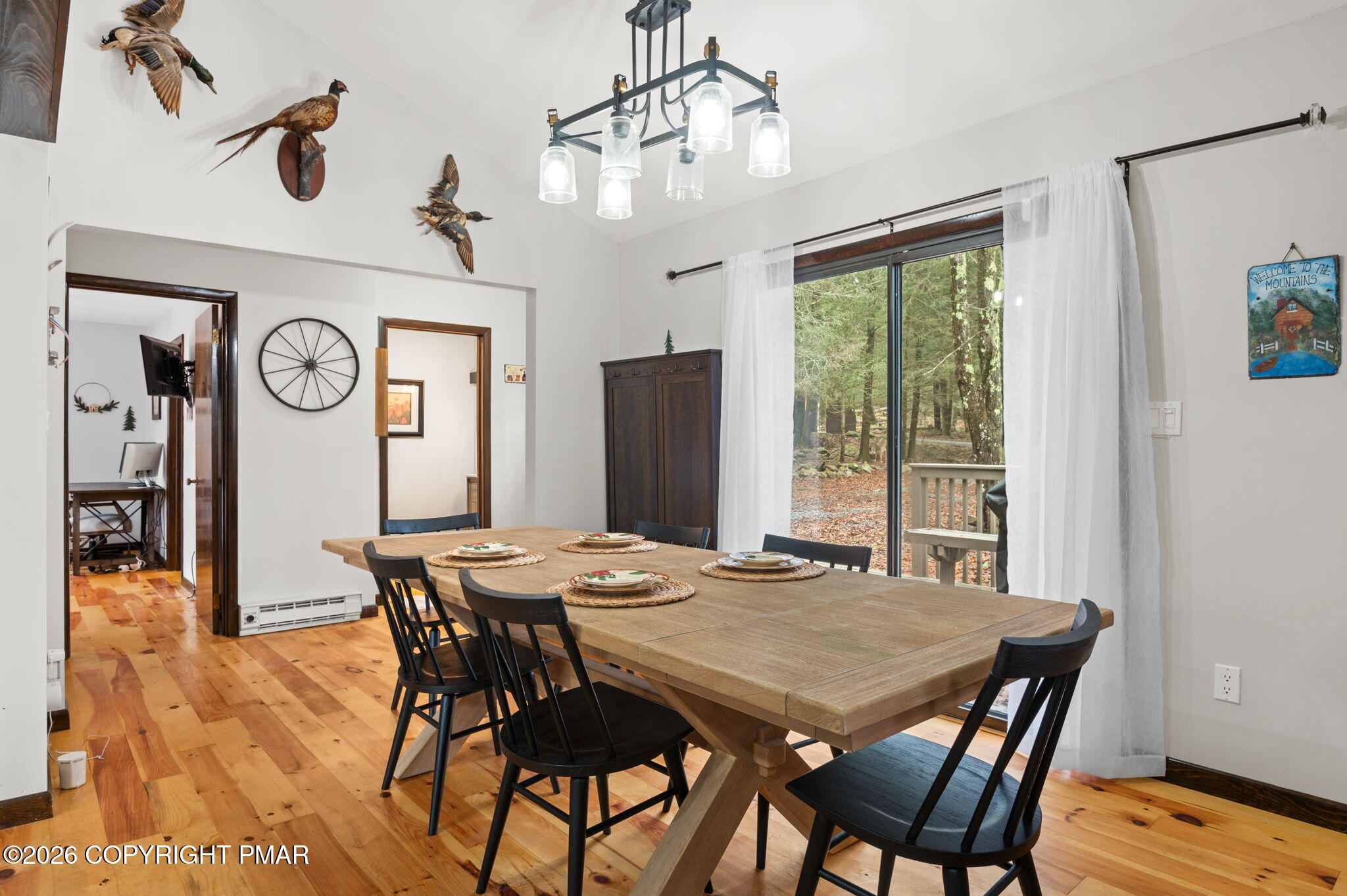 81 Split Rock Road Lake Harmony, PA 18624 - Photo 8 of 36 a view of a dining table and chairs in a room