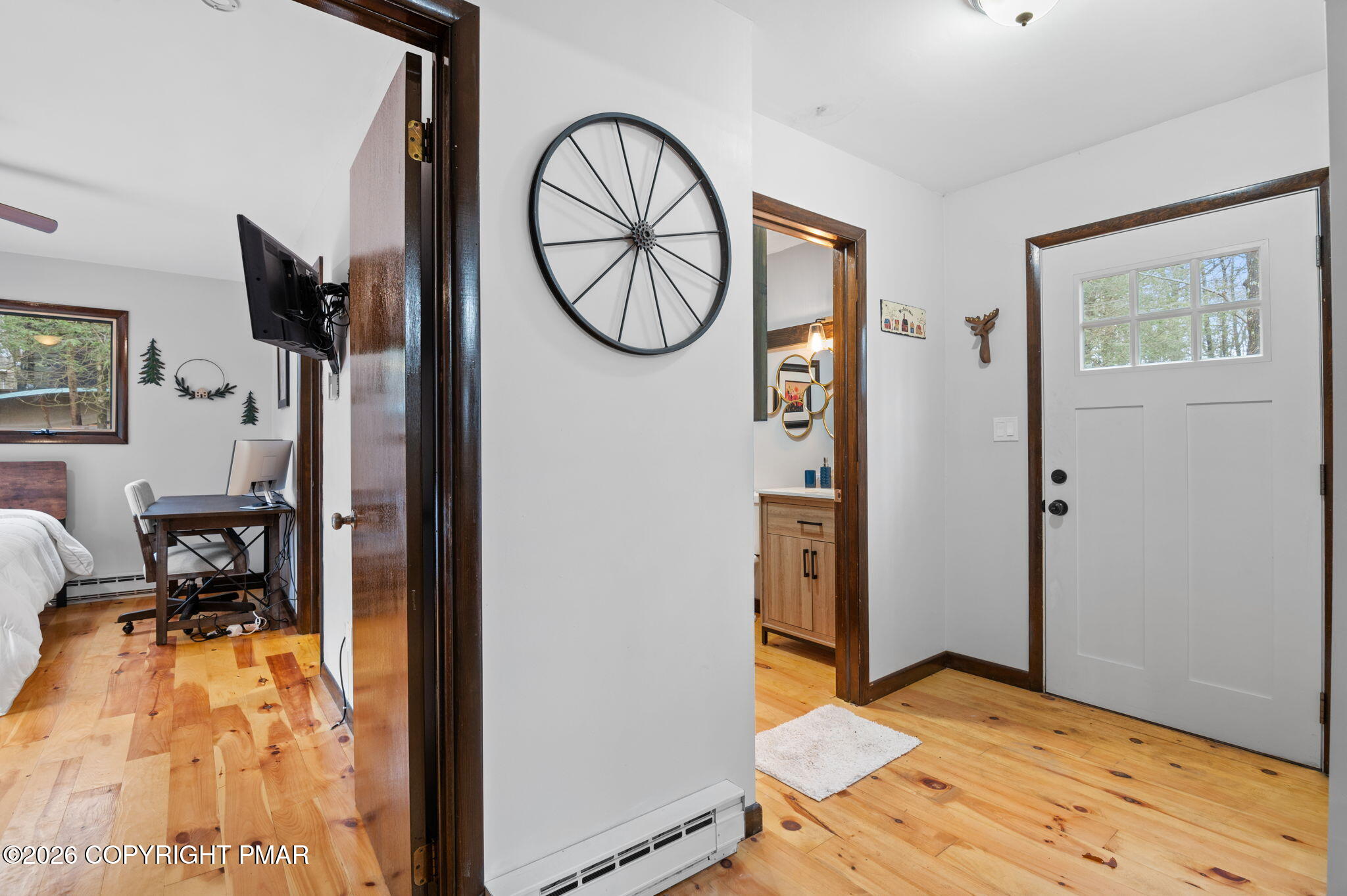 81 Split Rock Road Lake Harmony, PA 18624 - Photo 10 of 36 a view of a bedroom with bed and wooden floor