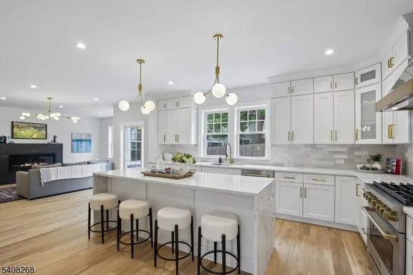 a large kitchen with a table and chairs
