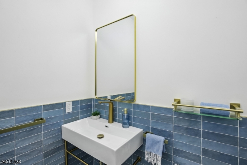 108 Baker Street Maplewood, NJ 07040 - Photo 24 of 46 a bathroom with a sink and a mirror