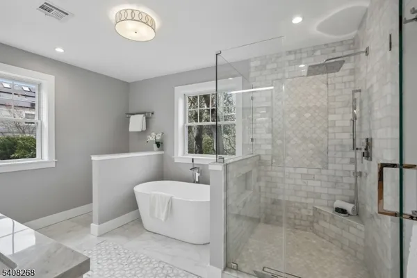 a white bath tub sitting next to a window