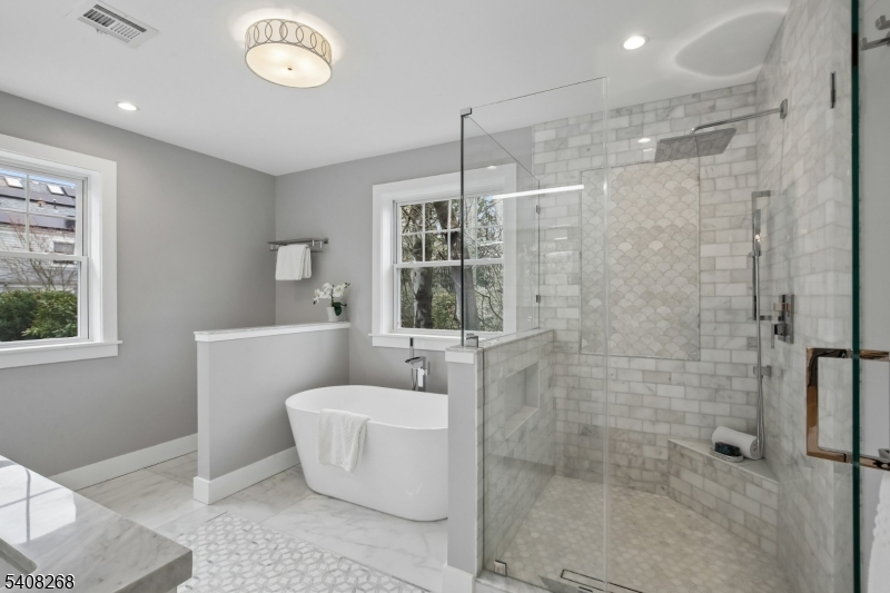 108 Baker Street Maplewood, NJ 07040 - Photo 28 of 46 a bathroom with a bathtub and shower