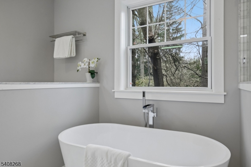 108 Baker Street Maplewood, NJ 07040 - Photo 29 of 46 a white bath tub sitting next to a window