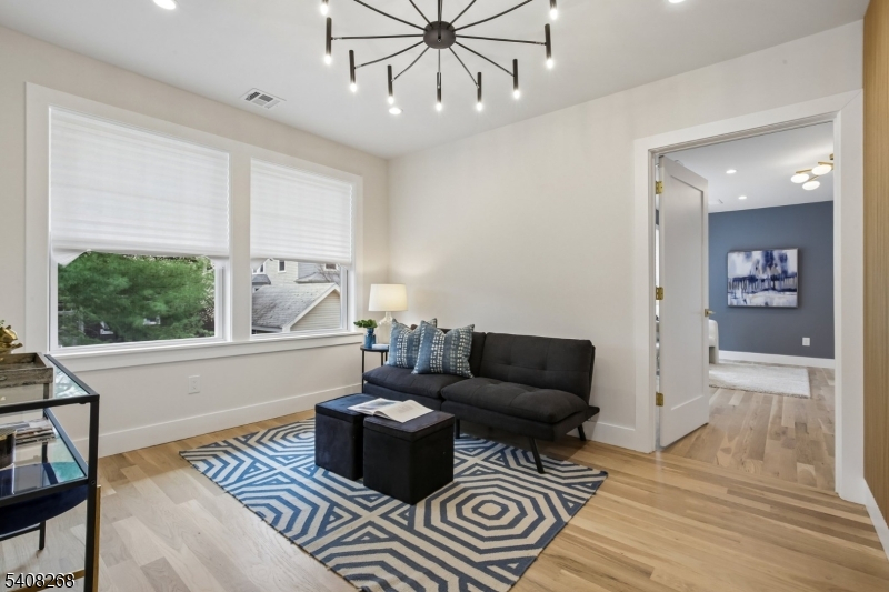 108 Baker Street Maplewood, NJ 07040 - Photo 32 of 46 a living room with furniture and a window