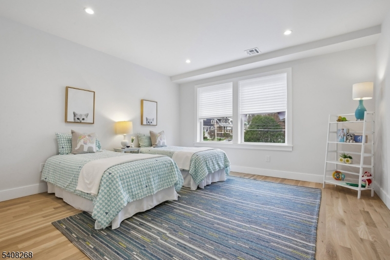 108 Baker Street Maplewood, NJ 07040 - Photo 33 of 46 a bedroom with a bed and a window